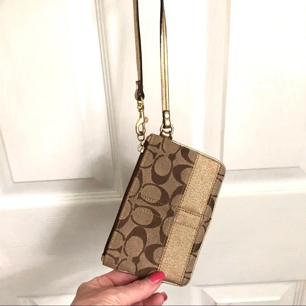 Coach signature tan wristlet, gold strap & stripe